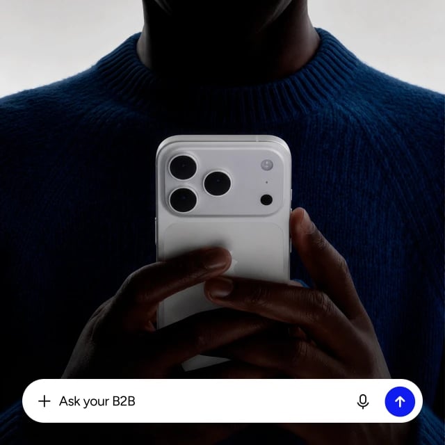 A sales representative uses Go2B on their phone. The prompt reads “Ask your B2B”.